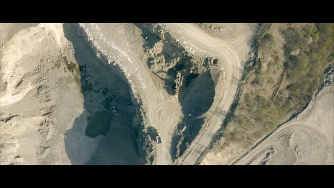 3 dumping truck inside a granite quarry Stock Footage 129135552