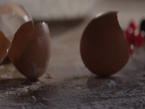 3 eggshells on the table. Super close-up of the camera movement. Stock-Footage 75317626