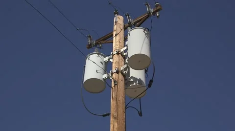 3 electrical transformers on a wooden pole Stock Footage 50092560