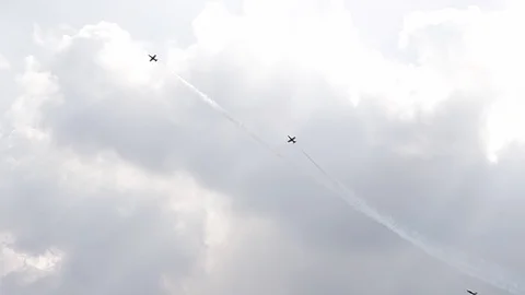3 fighter jets in the blue sky. A general plan. Aerobatic figures. Airshow. 8 Stock Footage 124164773