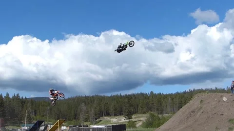 3 FMX riders jumping Stock Footage 43479301