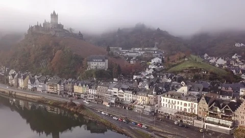 3 | FOG SETTING IN WHILE PANNING ACROSS A TOWN NAMED COCHEM | AERIAL Stock Footage 98996080