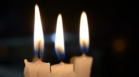 3 glowing candles Stock Footage 54941485