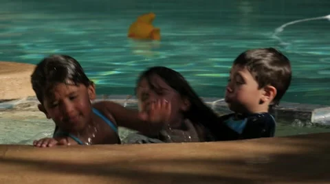 3 HISPANIC SIBLINGS PLAY IN JACUZZI IN SLOW MOTION Stock Footage 54621930