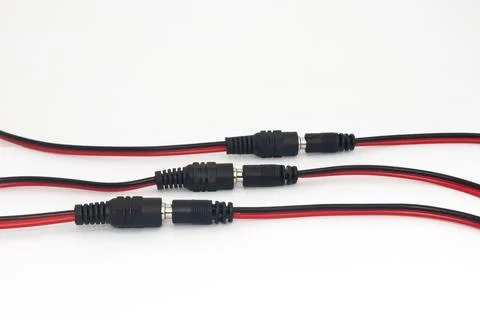 3 interconnected 12v DC connectors used as DIY electronics parts for electron Stock Photos