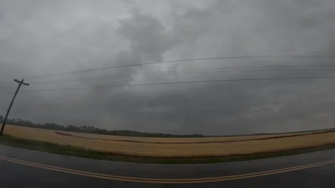 3 Long lightning strike and farmland in the country on a stormy cloudy day Stock Footage 176078558