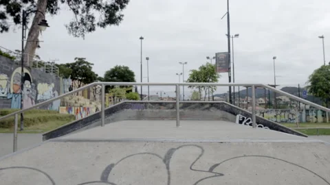3 males jump and spin at skatepark Stock Footage 171492660