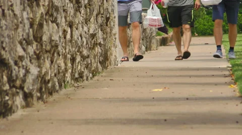 3 Men Walking on a Sidewalk Stock Footage 50035187