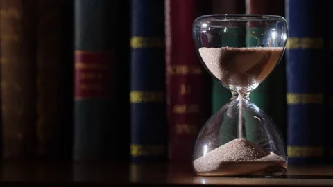 3 Minute Hourglass, Approaching End, Bookshelf Background Stock Footage 331106505