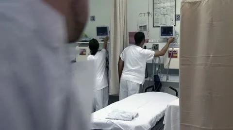 3 nurses set up emergency room Stock Footage 10903348