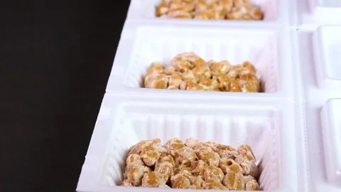 3 packets of Natto rotating Stock Footage 315920295