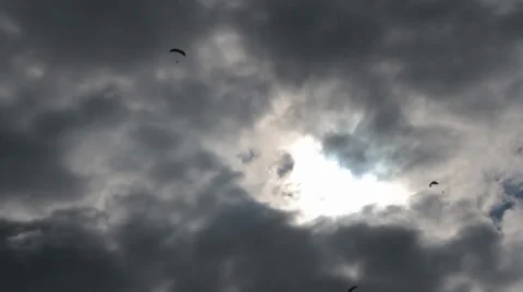 3 paragliders in sky on cloudy day Stock Footage 39018265