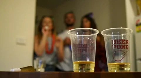 3 people playing Beer Pong Slow Motion Stock Footage