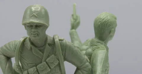 3 plastic, Toy army men rotating against white background Video stock 147694260
