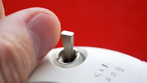 3 Position rocker switch or single pole toggle switch. Male hand turning on-off  Vidéo 82877243