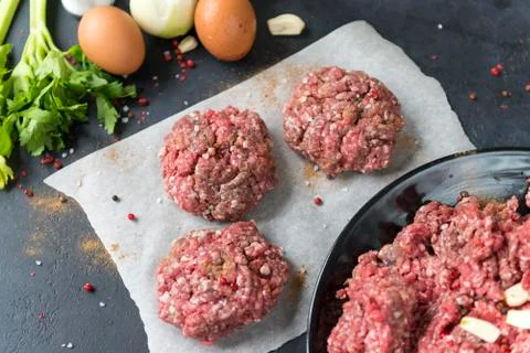 3 raw beef cutlets, burger , ground beef, spices, Eggs, celery, garlic, onion Stock Photos