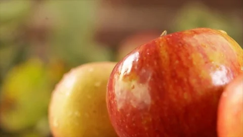 3 Red Apples Rotating Water Drops Closeup Stock Footage 99137105