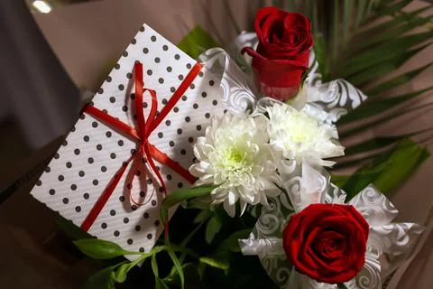 3 red roses  bouquet with gift envelope, red ribbons, white paper for certifi Stock Photos