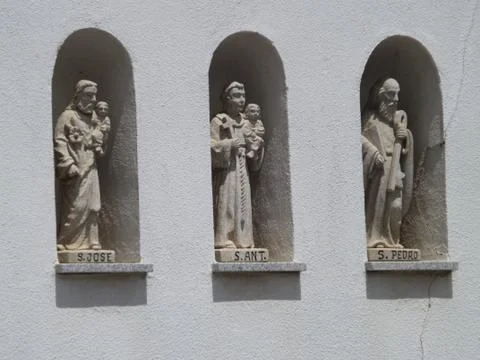 3 saint statues in a wall Stock Photos