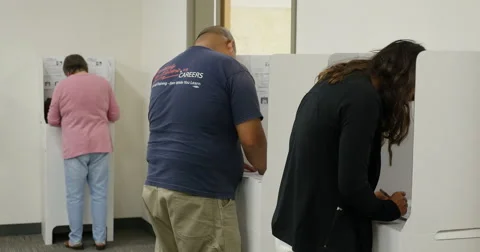 3 shot of People voting in the Mid term election of 2014, no faces Stock-Footage 43426537