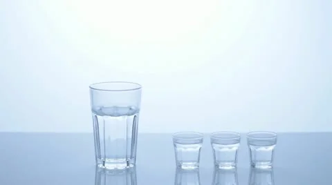 3 small water glasses - 1 taller Stock Footage 11606357