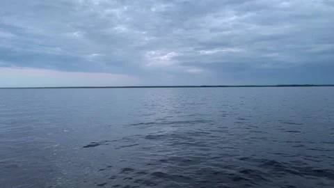 3 small waves on the lake and flying insects Stock Footage 170612039