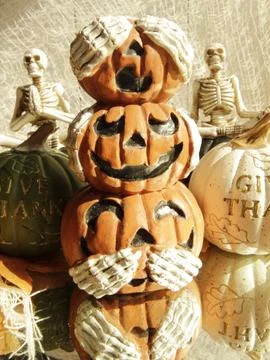 3 stacked jack o lantern pumpkins.. hear, see, speak no evil Stock Photos