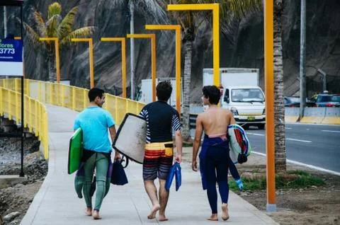 3 surfers Stock Photos
