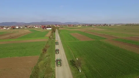 3 tractors on the road Stock Footage 82701402