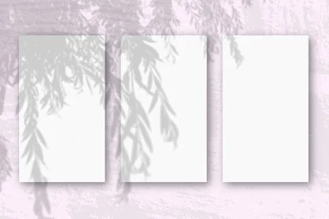 3 vertical sheets of textured white paper on soft pink table background. Mock Illustrazione stock