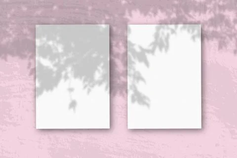 3 vertical sheets of textured white paper on soft pink table background. Mock Stock Illustration