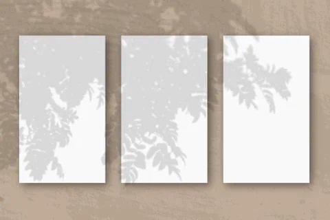 3 vertical sheets of textured white paper on brown table background. Mockup o Stock Illustration