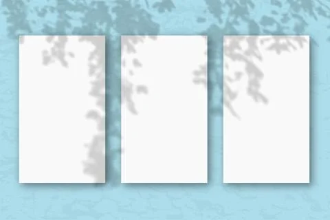3 vertical sheets of white textured paper on a pastel blue wall background Stock Illustration