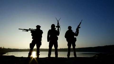 3 Warriors with weapons in hand and in the sunset Stock-Footage 204123534