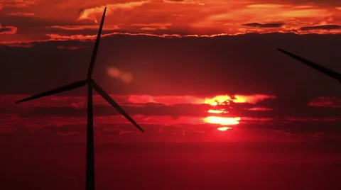 3 wind mills against red sunset - HD 動画素材 45943284