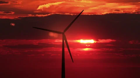 3 wind mills against red sunset - 4K Stock Footage 45944105