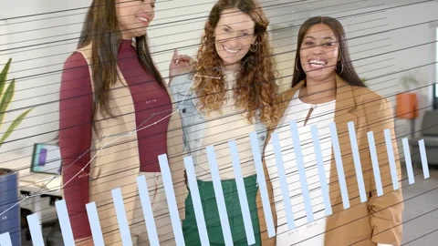 3 women posing while center placing hand on shoulder and tablet launching rising Stock Footage 332426233