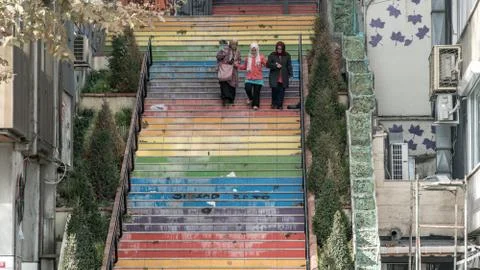 3 women walking down the stairs painted in rainbow colors in Istanbul, Turkey Stock Photos
