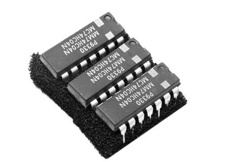 3 x 14 pin ICs punctured on an antistatic base viewed from above and with a w Stock Photos