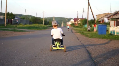 3 year old boy riding on bike Stockbeeldmateriaal 111501377