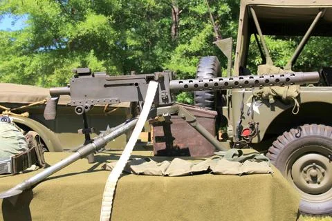 30 Caliber Machine Gun On Table Outside With Other Equipment And Jeep Stock Photos