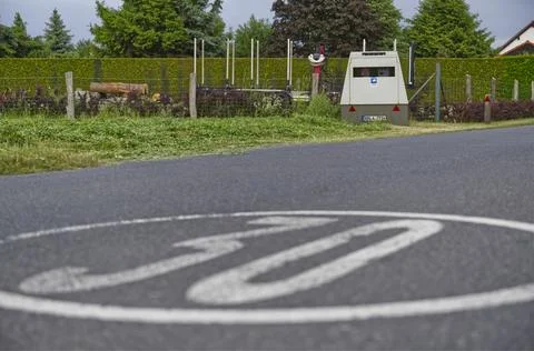 In a 30 kmh zone a speed camera is located in a trailer to automatically fl.. Stock Photos