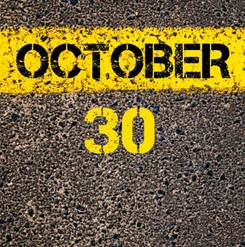 30 October calendar day over road marking yellow paint line Stock Photos