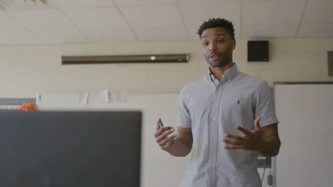 30-Something Teacher Gives Instructions to His Class Through Zoom Stock Footage 208785949