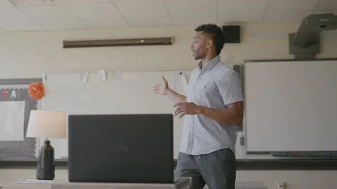 30-Something Teacher Talks to His Class Through Zoom During Pandemic Stock Footage 208786395