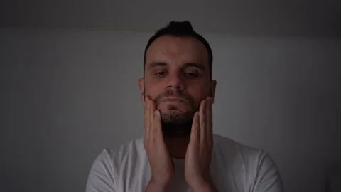 30-year-old man applies foam for washing on his skin Stock Footage 294524082