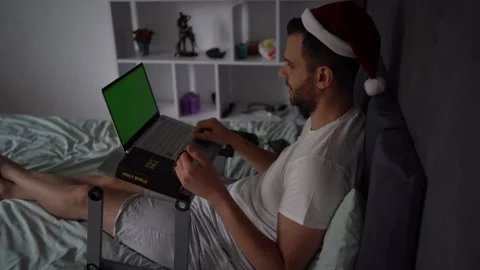 A 30-year-old man with a Bible attends an online church service, talks with.. Stock Footage 294521592
