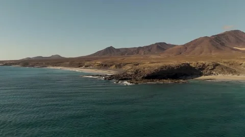 Wide circle around cliffs Juan Gomez Beach, Jandia, Fuerteventura - Aerial Drone