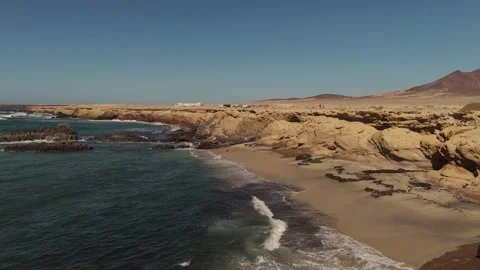 Caves and Cliffs at Beach, Playa de los Ojos, Fuerteventura - Aerial Drone