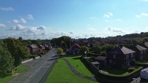 30.8.26 Lush Eccleston town homes and gardens aerial view rising above landscape 스톡 동영상 344050792